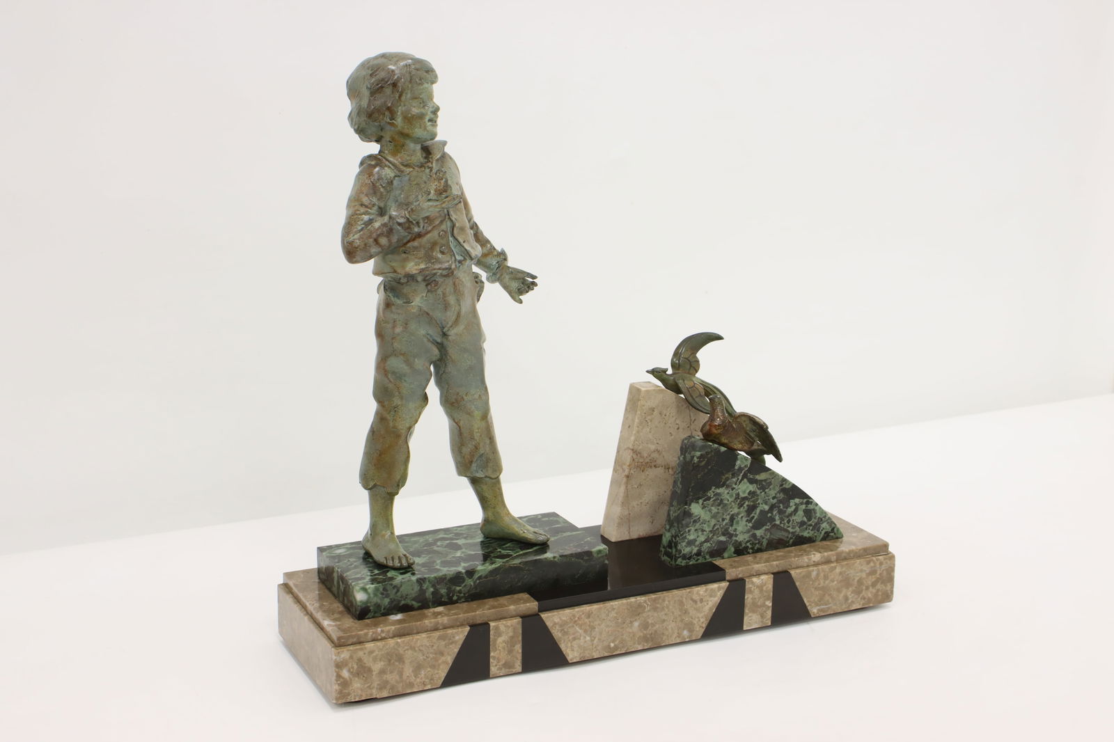 Art Deco Antique Boy & Birds Sculpture, Marble Base #48751: An Art Deco period sculpture is of a young boy with birds and rests on a beautiful marble base. American antique 1920s artwork. Spelter cast metal sculptures with a wonderfully patinated finish. In ve