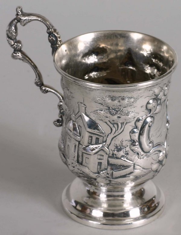 Estate Silver: American Coin Silver Scenic Repouse Decorated Fancy handled mug Marked on base "A. E. Warner" 11 ounces and marked in cartouche "Frank Churchill Woods 1862" Baptismal mug For F. C. Woods Washington, D
