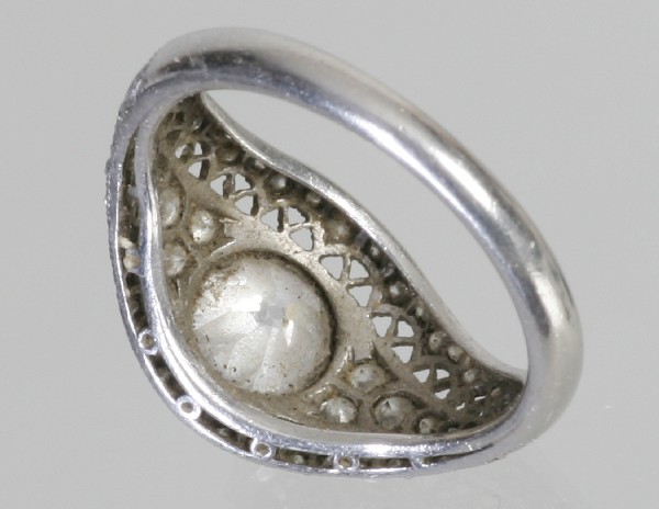 Ladies Edwardian Platinum Diamond Ring: Edwardian Ladies platinum diamond ring. Center w/old mine cut diamond weighing approximately 0.90 ct. color:I-J (near colorless). clarity: SI 1 (slightly included.) The diamond has a small chip on out