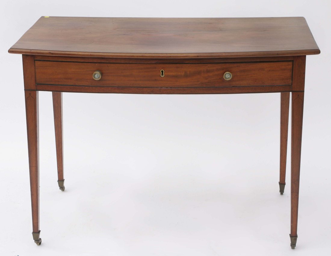 English Hepplewhite Mahogany Table: English Hepplewhite mahogany writing or silver table having a molded edge bow-fronted top, single drawer, raised on square tapered legs. Late 18th or early 19th C. H: 30", W: 41", D: 23". (Top with st