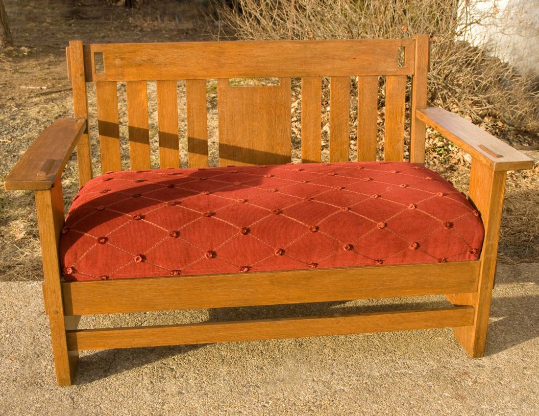 Charles Stickley Oak Settle Bench: Charles Stickley Arts and Crafts oak settle bench circa 1900-1915 having through-mortised construction. Refinished many years ago. Width 58.50", maximum H: 37", D: 26.50".
