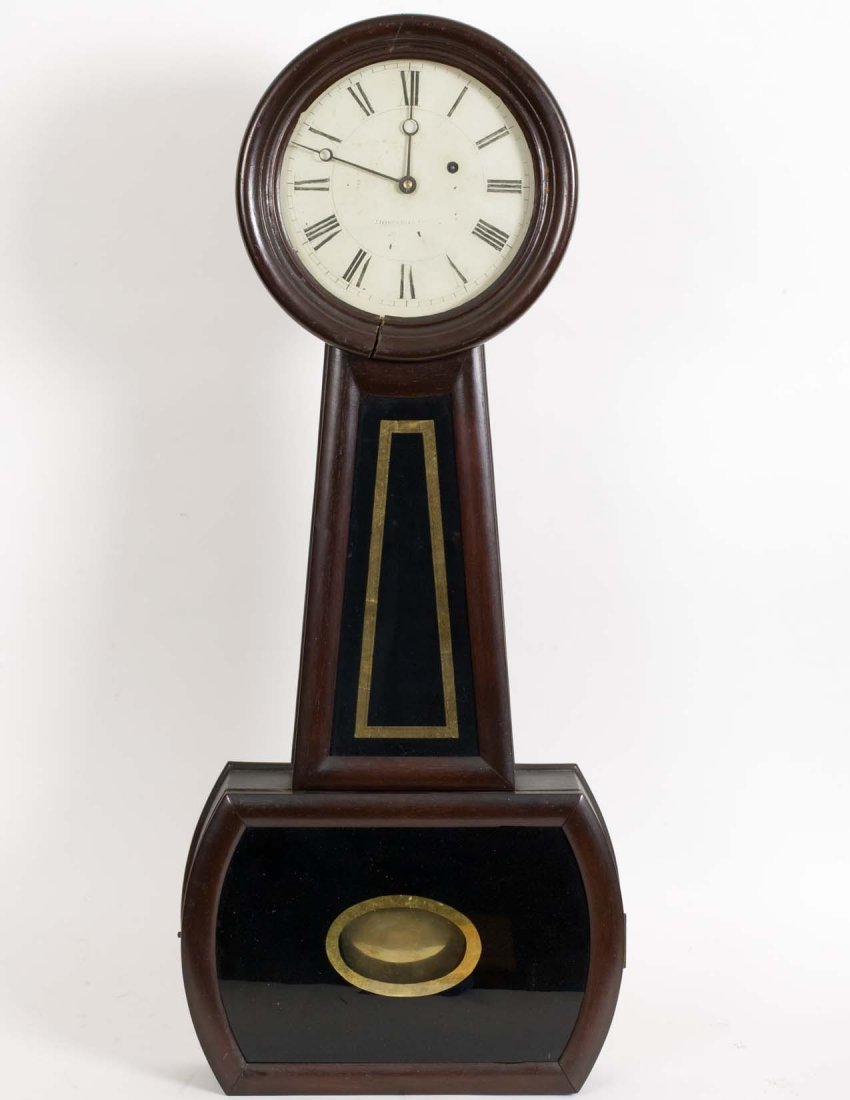 Howard & Davis 38" Banjo Clock: HOWARD AND DAVIS MAHOGANY BANJO CLOCK Length 38". The clock having its original glasses, old finish. Small repairs to bezel door, pendulum bob possibly later replacement. Face faintly marked Howard an