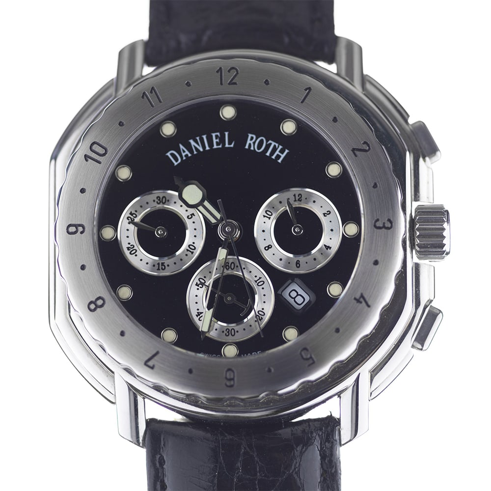 Daniel Roth - Sport Chronograph Watch : The case Is polished stainless steel with a brush-finished uni-directional engraved bezel. The caseback Is brush-finished. The crystal Is scratch-resistant sapphire. The crown Is push-down. The dial I