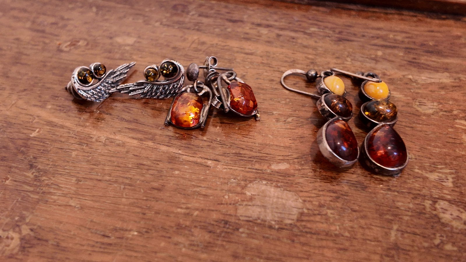 Three pairs of antique sterling silver amber earrings.: Three pairs of antique sterling silver amber earrings.