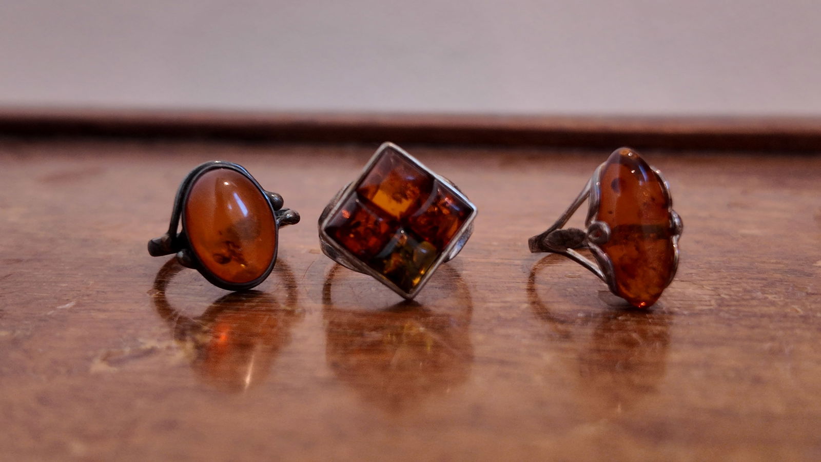 Three pieces of antique sterling silver amber rings (1 of 3)