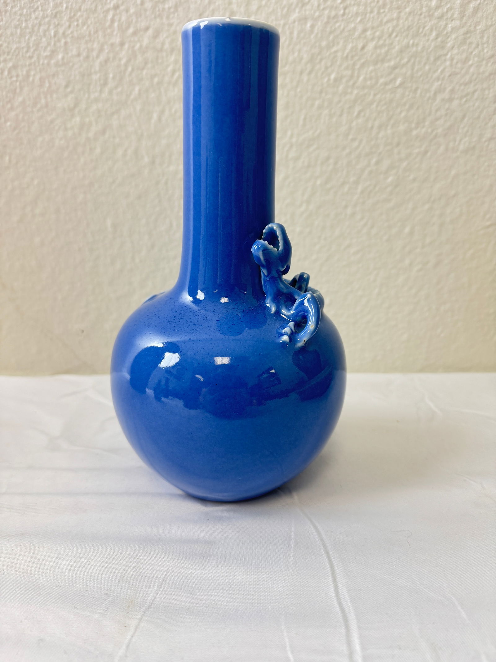 A Chinese Blue Vase with Dragon Sculpture: Located in the USA.