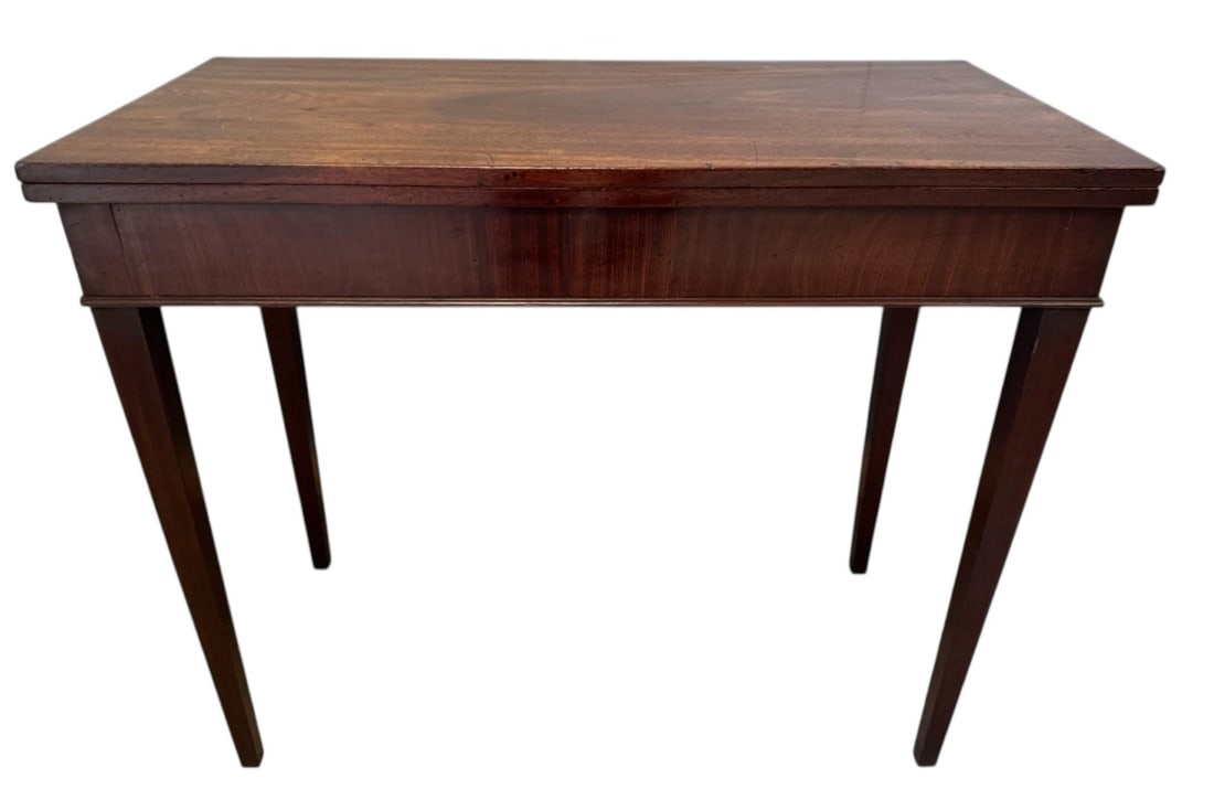 A 19TH CENTURY MAHOGANY FOLDOVER TEA TABLE Raised on square section legs. (h 73.5cm x d 44cm x w: A 19TH CENTURY MAHOGANY FOLDOVER TEA TABLE Raised on square section legs. (h 73.5cm x d 44cm x w 89cm)