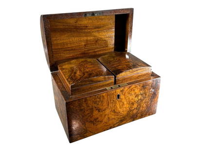 A 19TH CENTURY WALNUT TEA CADDY Rectangular form with domed lid, open to reveal to hinged lidded: A 19TH CENTURY WALNUT TEA CADDY Rectangular form with domed lid, open to reveal to hinged lidded compartments. (h 17cm x w 22.3cm x d 13.3cm)