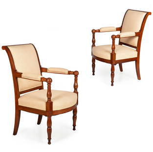 French Empire Mahogany Fauteuil Arm Chairs, circa 1820-40: A Fine Pair of Empire Mahogany Fauteuils with Spherical Arm Terminals, manner of Jacob-Desmalter, France circa 1820-40, stamped 1635 in legs. For a similar example attributed (but not stamped) to the