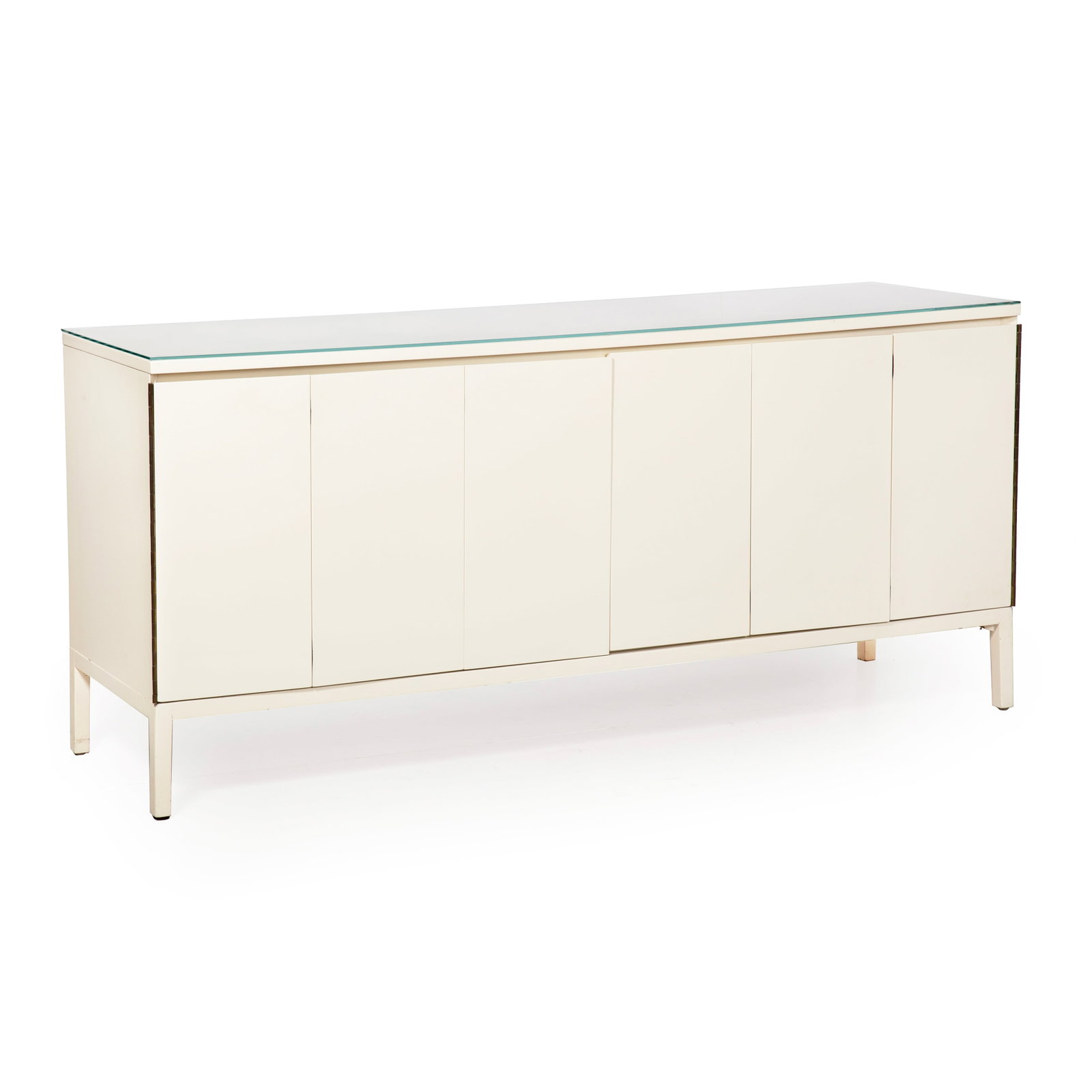 White Lacquered Modernist Credenza Storage Cabinet with Glass Top: White Lacquered Modernist Credenza With Glass Top Late 20th century. Long white lacquered credenza or sideboard with inset glass top, raised on square legs, the plain exterior doors opening to reveal 