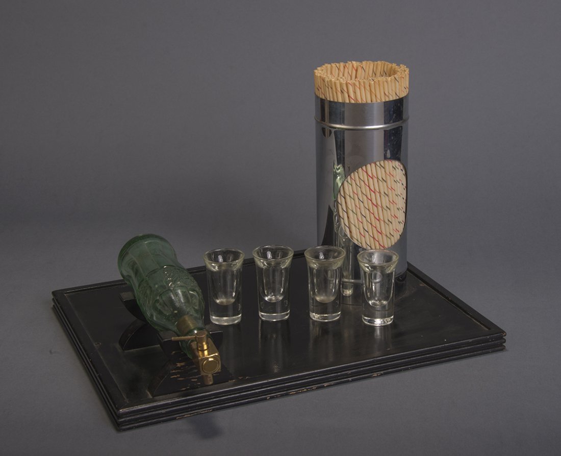 Abbott Coke A Plenty: An empty glass Coca Cola® bottle is shown and placed is a stand atop a tray. A brass spigot is inserted and then many glasses of Coke® are poured from the apparently empty bottle. A wonderful self-c