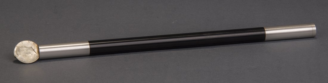 Owen Coin Wand: A 50 cent piece appear at the tip of this cleverly gimmicked magic wand. An apparently endless production may be made. Mechanically perfect, made of sturdy metal. Finished black with gold tips and bot