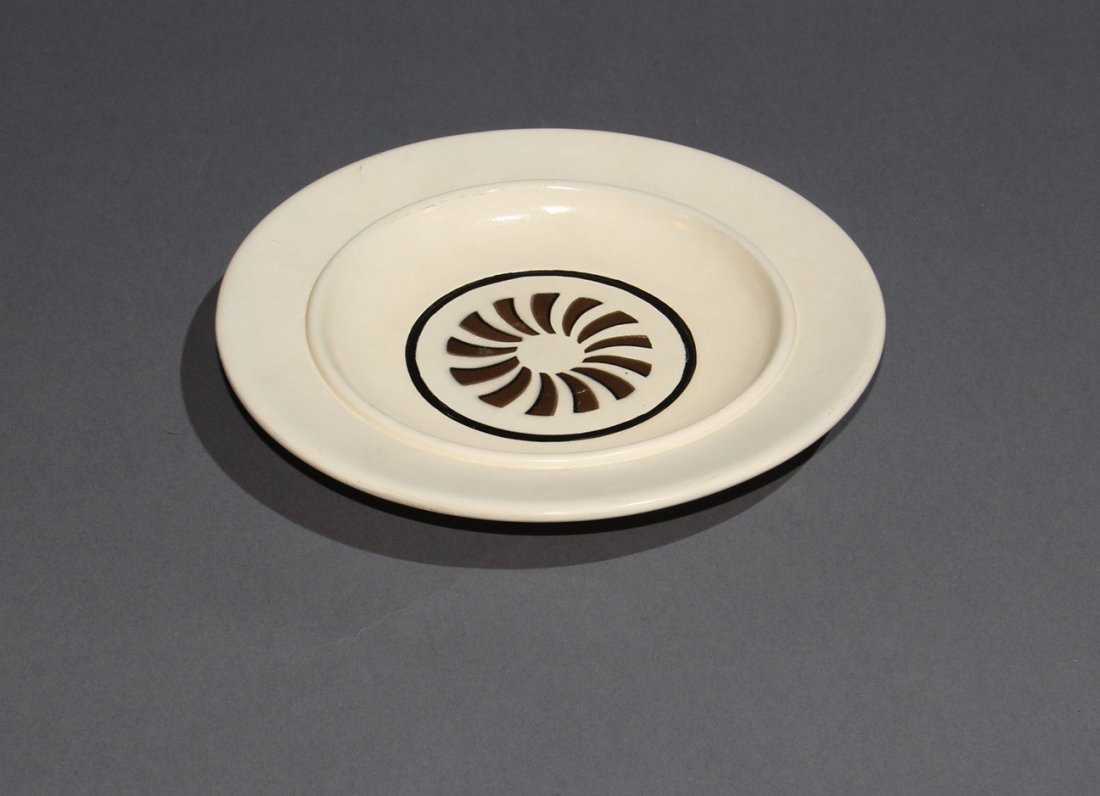 HANDKERCHIEF AND SOUP PLATE – F.G. THAYER: A handkerchief vanishes and reappears under an overturned soup plate resting on a piece of newspaper. 9” diameter faux china plate turned of wood by Thayer. c. 1940. Very Good condition.