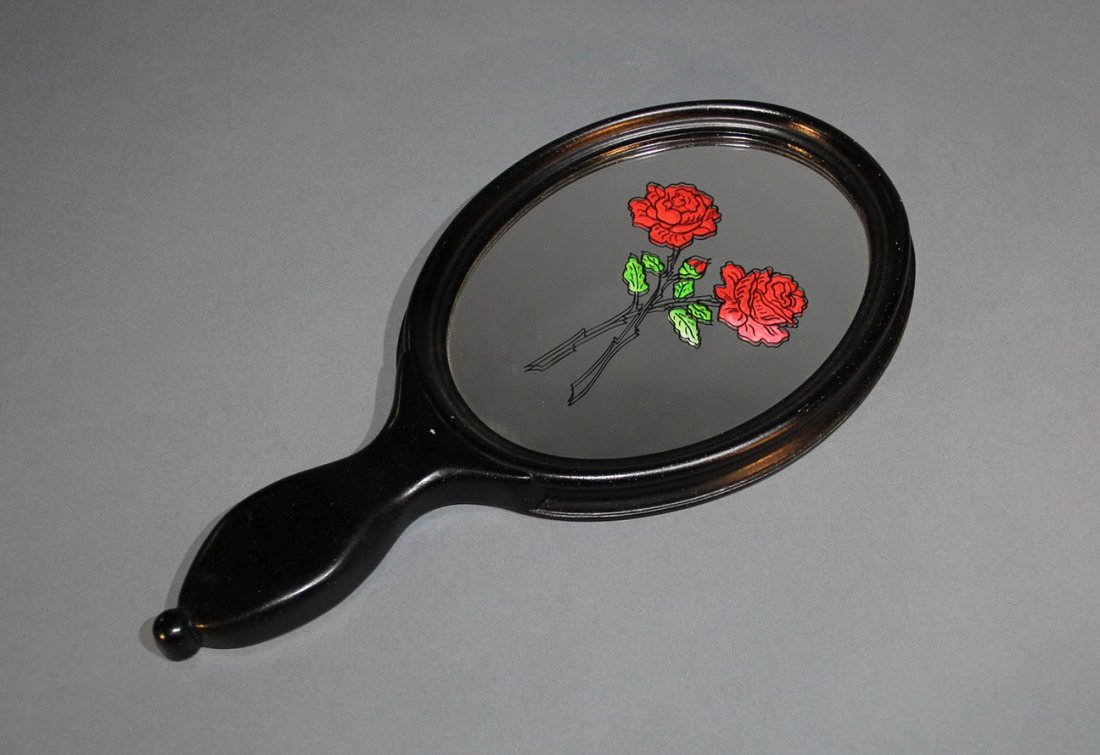 ROSE MIRROR - ZZM MAGIC: Inspired by Hofzinser, this re-creation by Harold Voit and Tony Lancker, circa 1985 is superbly made. The image of two roses appear, apparently etched on a blank, 15 ½” long hand mirror. Color begi