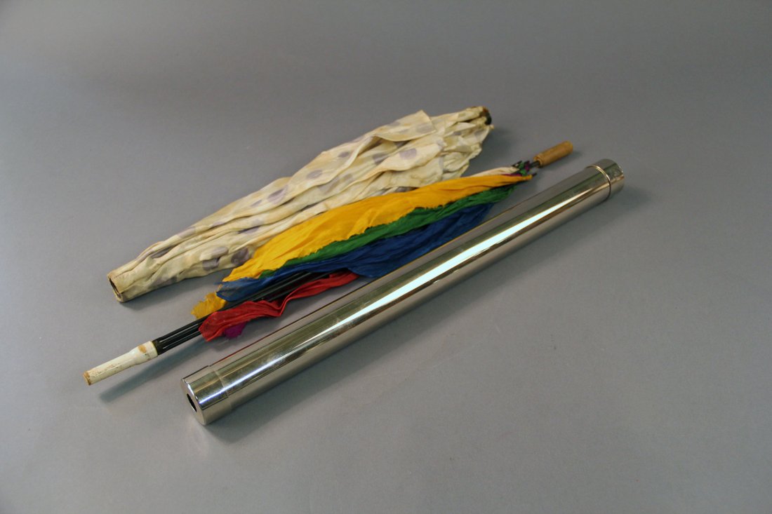 Abbott’s Parasol Tragedy: Advertised in Abbott catalog #7 (1943.) Six handkerchiefs are borrowed from ladies in the audience and placed into a paper sack that is held by a volunteer. A parasol is shown, along with a chromed tu