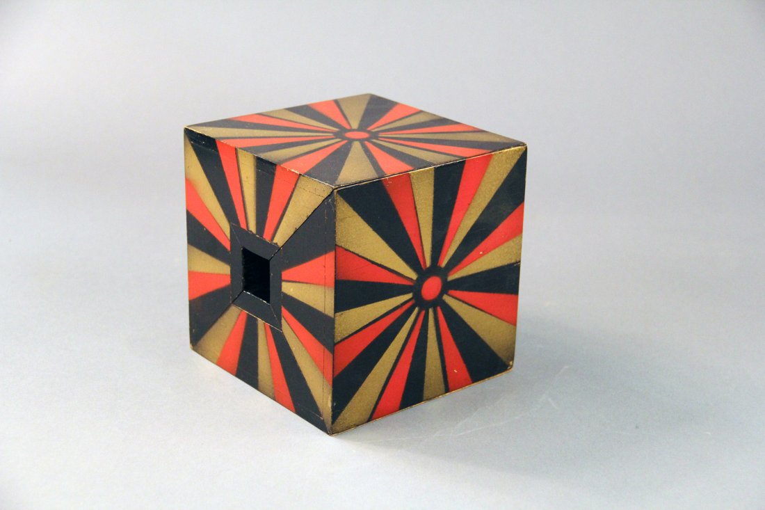 Block and Ribbon: Abbott. Circa 1940. Created by Les Levante. A ribbon (not supplied) and brightly decorated 6” block of wood are passed for examination. The ribbon is threaded through the block, with the ends of the