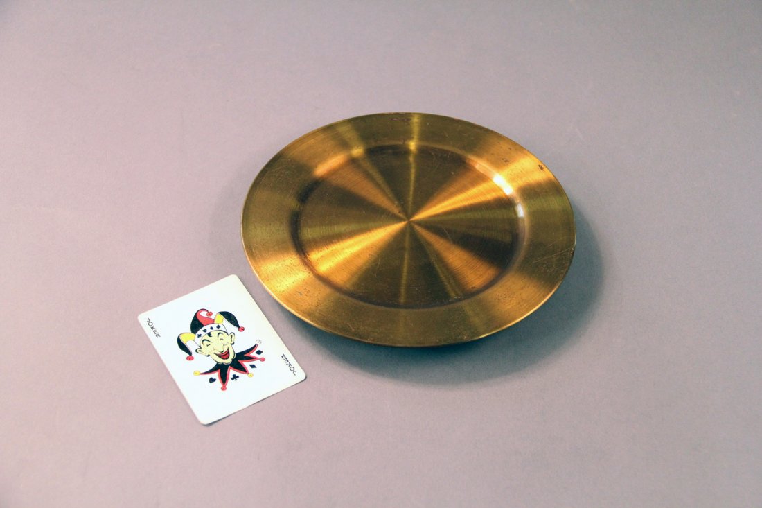 Card Tray: American. Circa 1940. Cards counted on to a small brass tray may be caused to multiply or change. Useful accessory for the classic “Cards Across” effect. Condition: Very good. Should be polished.