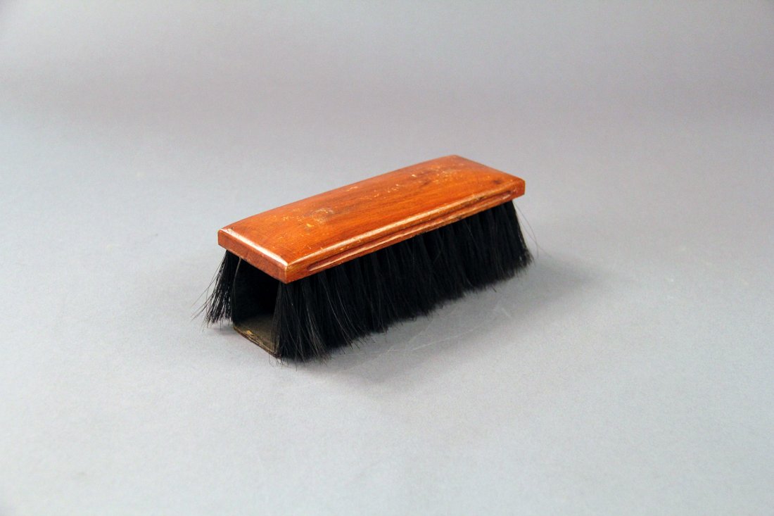 Hat Brush/Loader: Circa 1920. A spectator’s hat is borrowed and cleaned using a hat brush. In the process, the magician may load silks or other articles into the hat, unknown to the audience. The brush contains a lar