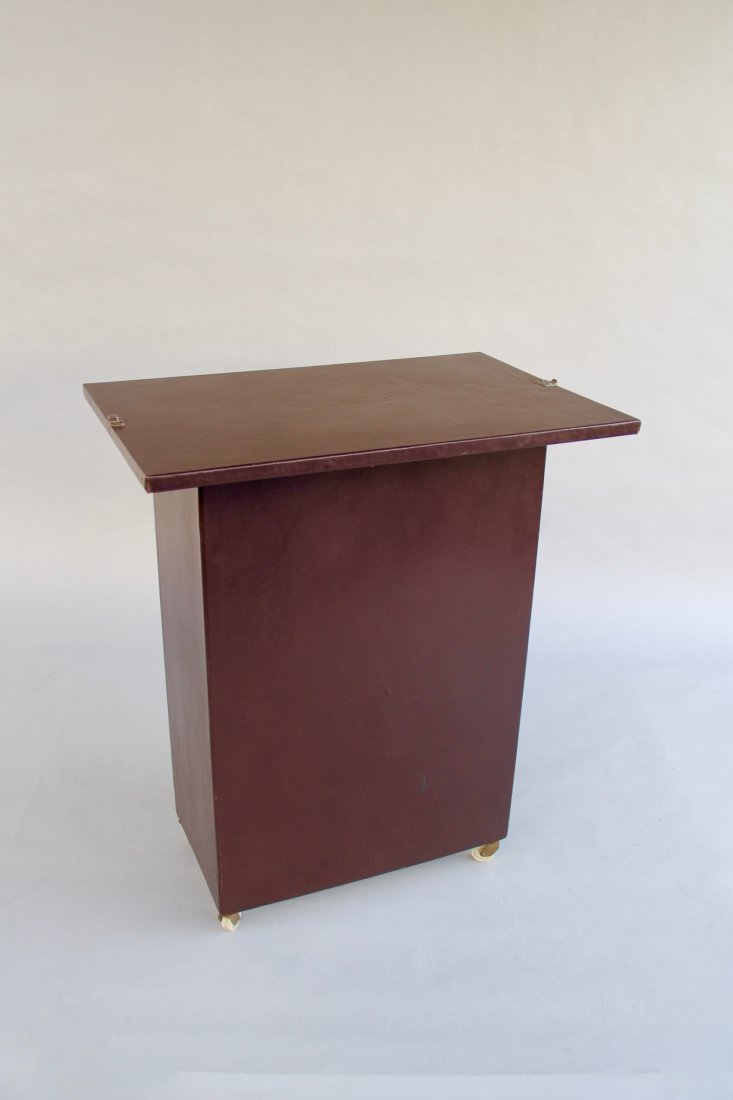 Himber Night Club Table: Circa 1960. Rolling box/case with removable back that is secured atop the box to become a large working surface. Custom made by Himber’s case builder, Gene Strocco. Beautifully finished in real leat