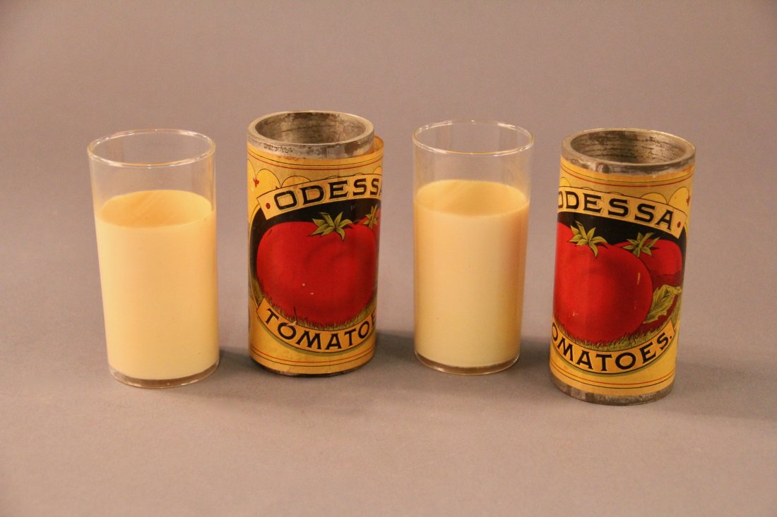 Passe-Passe Milk Glass: Circa 1910. A glass of milk travels invisibly between two tomato cans. Tubes may be shown empty at any time. A charming piece of “folk art” apparatus. Likely unique. Condition: Very good for age.