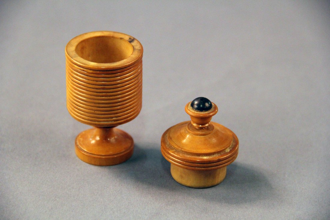 Plug Box: German. Circa 1910. Finely turned 3 ½“ tall boxwood vase will cause a quarter or similar sized coin to vanish or appear. Condition: Very good.