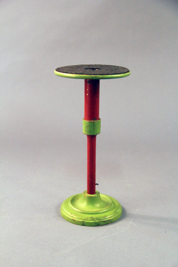 Thayer Tumbler Pedestal: Circa 1915. Early red and green finished, turned pedestal for the appearance of a silk handkerchief in a glass tumbler (silk and tumbler not included.) Uncommon color combination. Condition: Very good