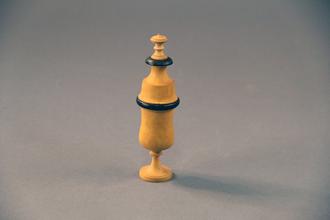 Vanishing Shilling Vase - Gamage: Circa 1900. A shilling or half dollar coin (not included) vanishes and appears inside of a 5 inch tall boxwood vase. Condition: Excellent.