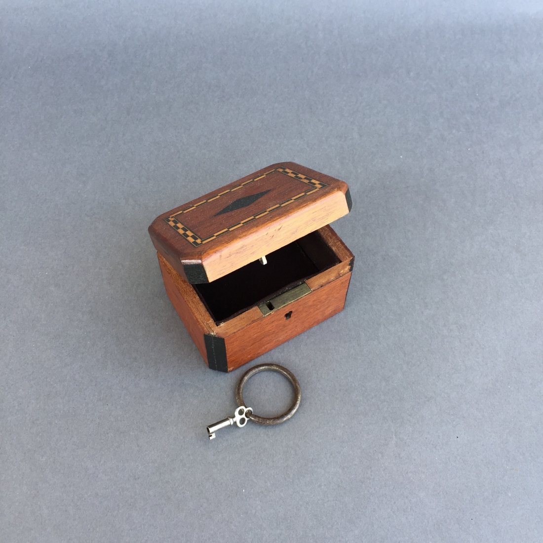 Watch Box: A beautiful antique prop that will allow the magician to secretly remove from or introduce items into this locked box. Very beautifully made.