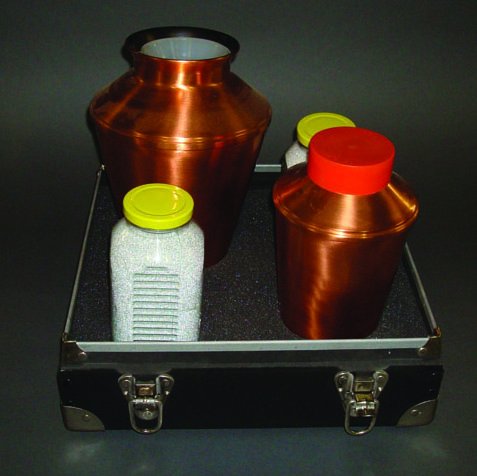(Apparatus) Sand Canisters (The Shifting Sands).: (Apparatus) Sand Canisters (The Shifting Sands). Owen Magic, ca. 1972. These beautiful heavy copper vases, one with a capacity four times that of the other. From the small vase the magician fills to o