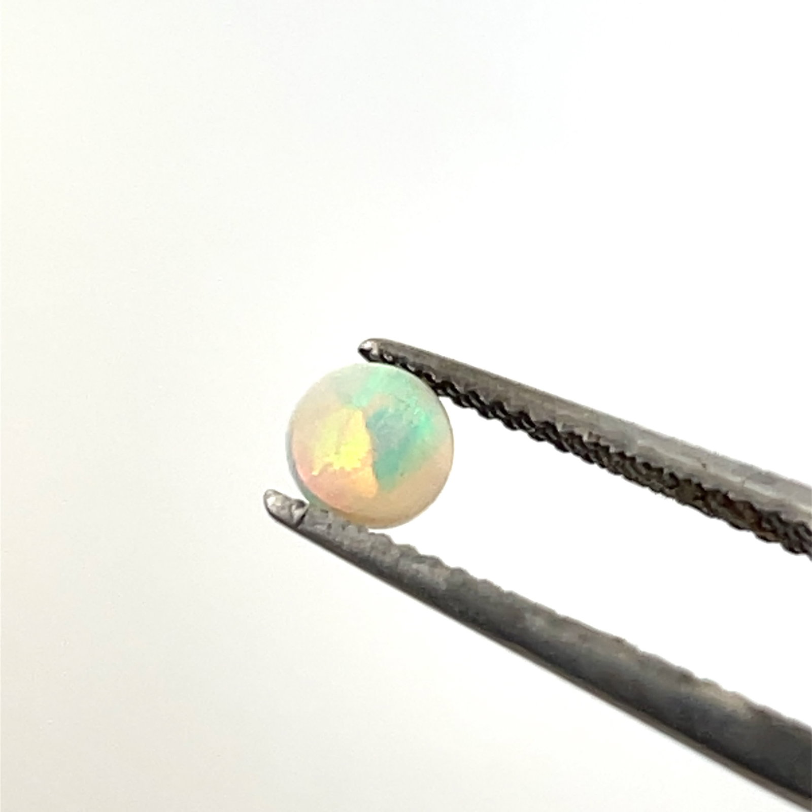 Round White Opal Selection Loose Gemstone - 4.5 - 1.38ct: These gems are from the estate of a professional jeweler. They were his pesonal collection, many faceted by himself. This is the first of several auctions of his jewelry making materials. Gems were ca