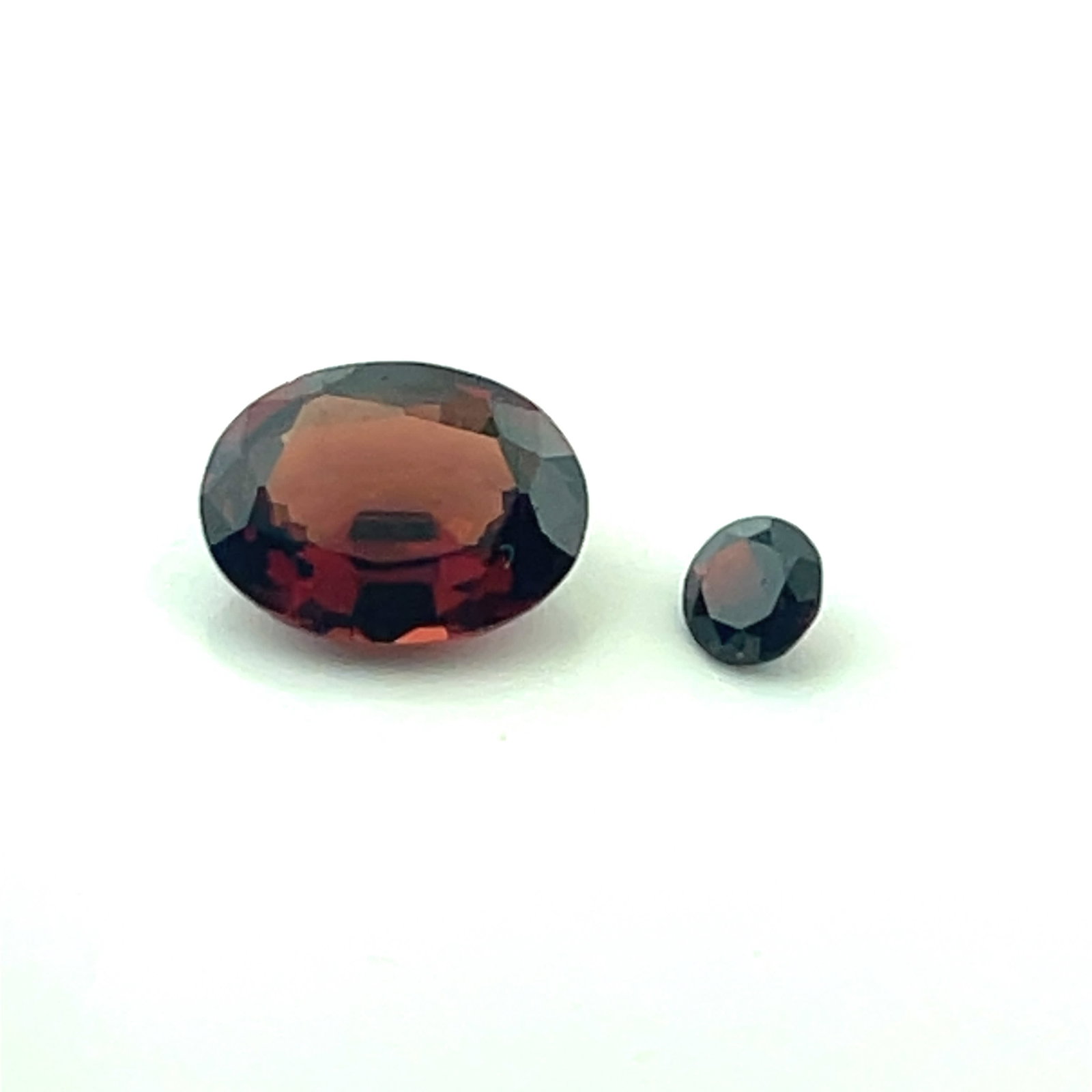 Loose Gemstone Radiant Cut Garnet plus Smaller Color Match - 2.16ct - 9x7: These gems are from the estate of a professional jeweler. They were his personal collection, many faceted by himself. This is the first of several auctions of his jewelry making materials. Gems were c