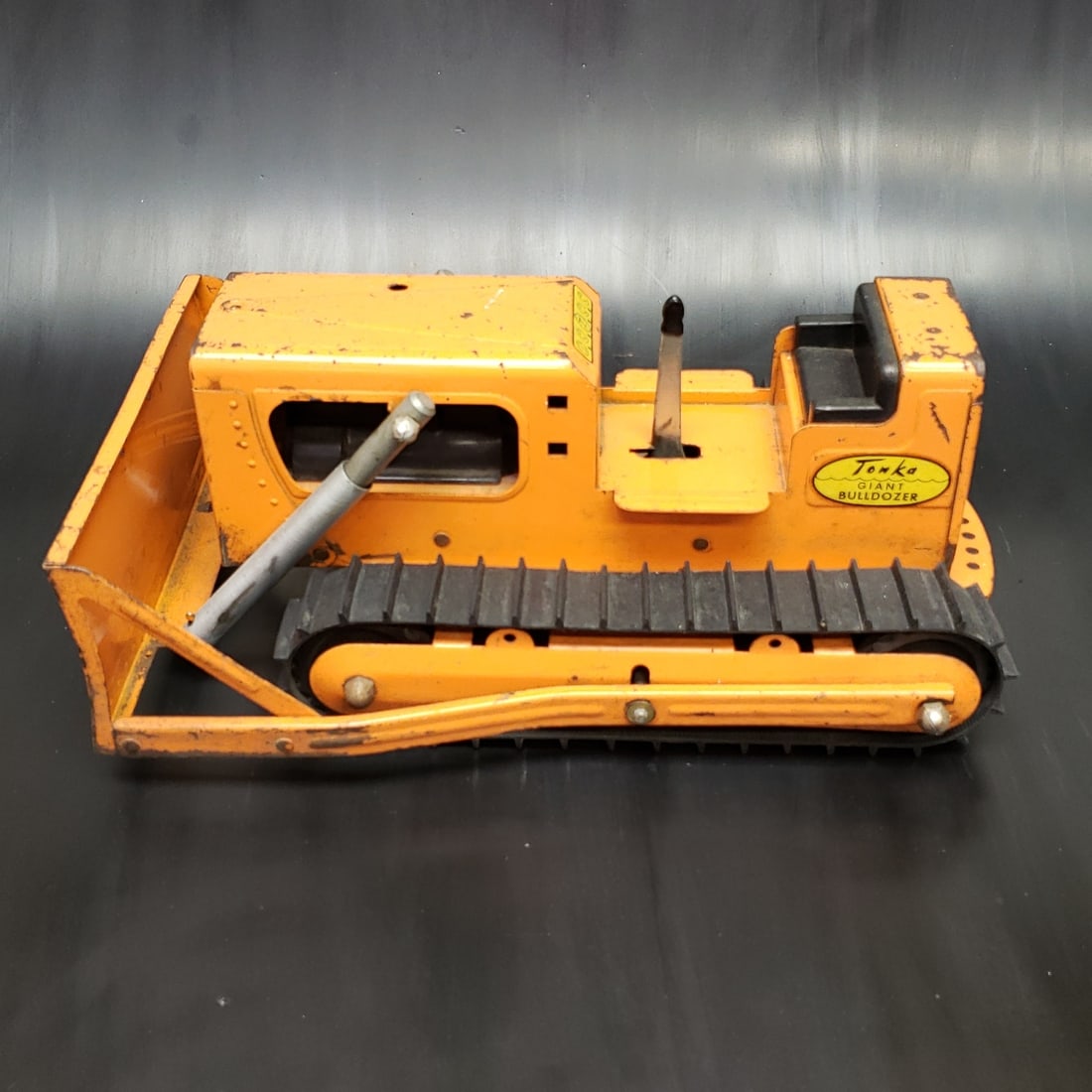 Tonka Giant Dozer - Orange - Wheels and Mechanisms Working: "Fresh to market from a lifetime collector. A nice selection of vintage tin and pressed steel along with die cast model and car related ephemera. All measurements are approximate.