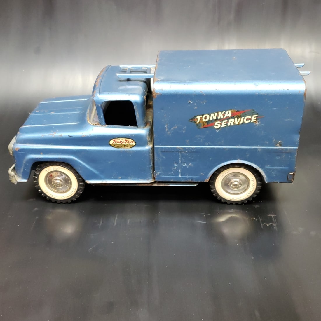 Vintage Tonka Service Truck: "Fresh to market from a lifetime collector. A nice selection of vintage tin and pressed steel along with die cast model and car related ephemera. All measurements are approximate.