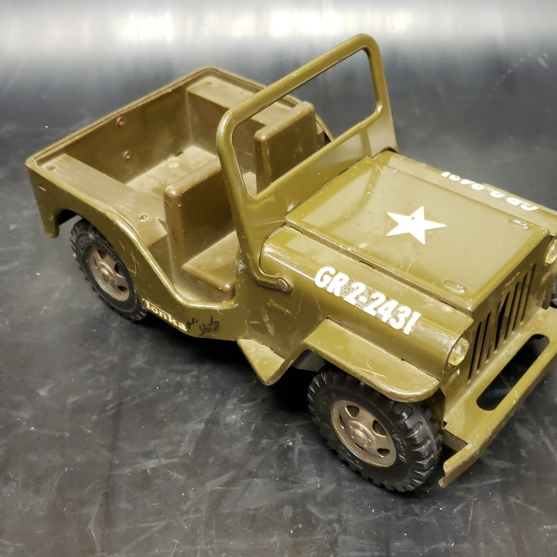 1960's Tonka Army Jeep: "Fresh to market from a lifetime collector. A nice selection of vintage tin and pressed steel along with die cast model and car related ephemera. All measurements are approximate.