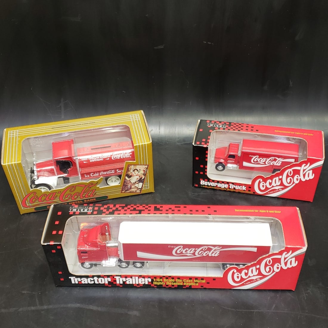 Coca Cola Die Cast Truck Bank Selection #1: "Fresh to market from a lifetime collector. A nice selection of vintage tin and pressed steel along with die cast model and car related ephemera. All measurements are approximate.