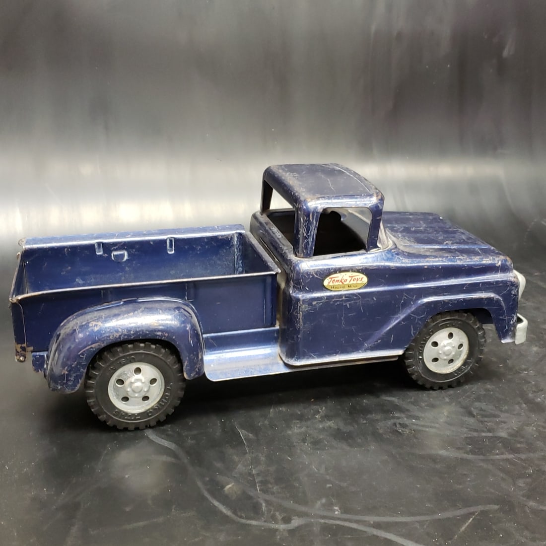 1958 Tonka Blue Step Side Truck: "Fresh to market from a lifetime collector. A nice selection of vintage tin and pressed steel along with die cast model and car related ephemera. All measurements are approximate.