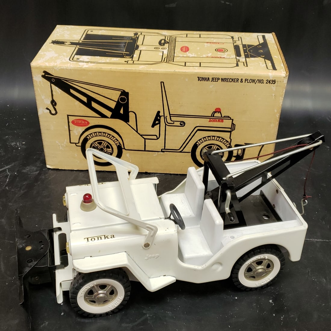 Tonka Jeep Wrecker and Plow No 2435 in Box: "Fresh to market from a lifetime collector. A nice selection of vintage tin and pressed steel along with die cast model and car related ephemera. All measurements are approximate.