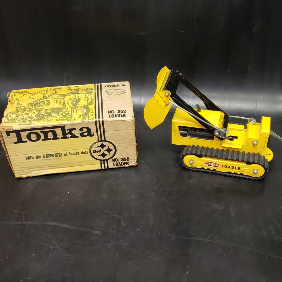 Tonka No 352 Loader in Box: "Fresh to market from a lifetime collector. A nice selection of vintage tin and pressed steel along with die cast model and car related ephemera. All measurements are approximate.