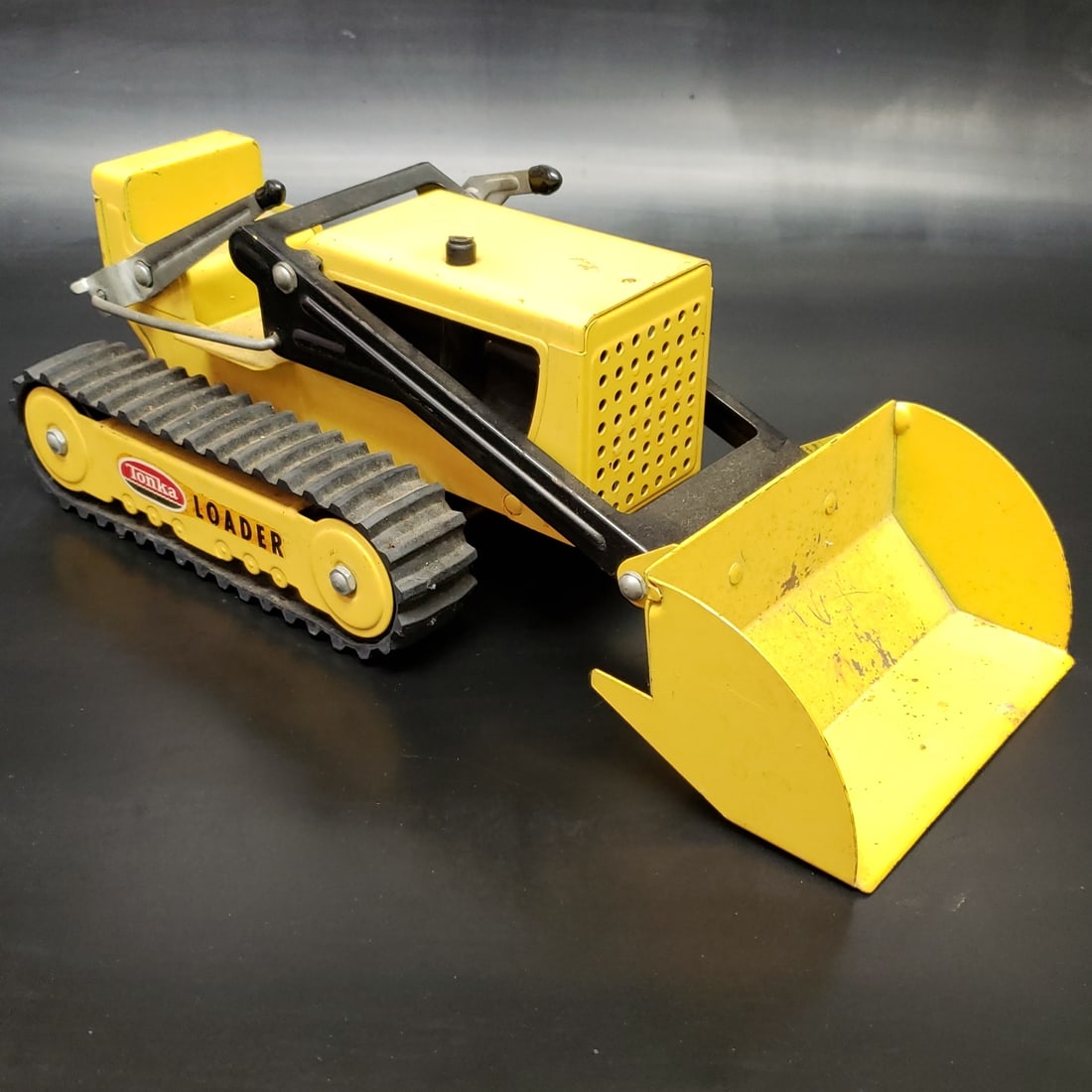 Tonka 352 Pressed Steel Yellow Loader: "Fresh to market from a lifetime collector. A nice selection of vintage tin and pressed steel along with die cast model and car related ephemera. All measurements are approximate.