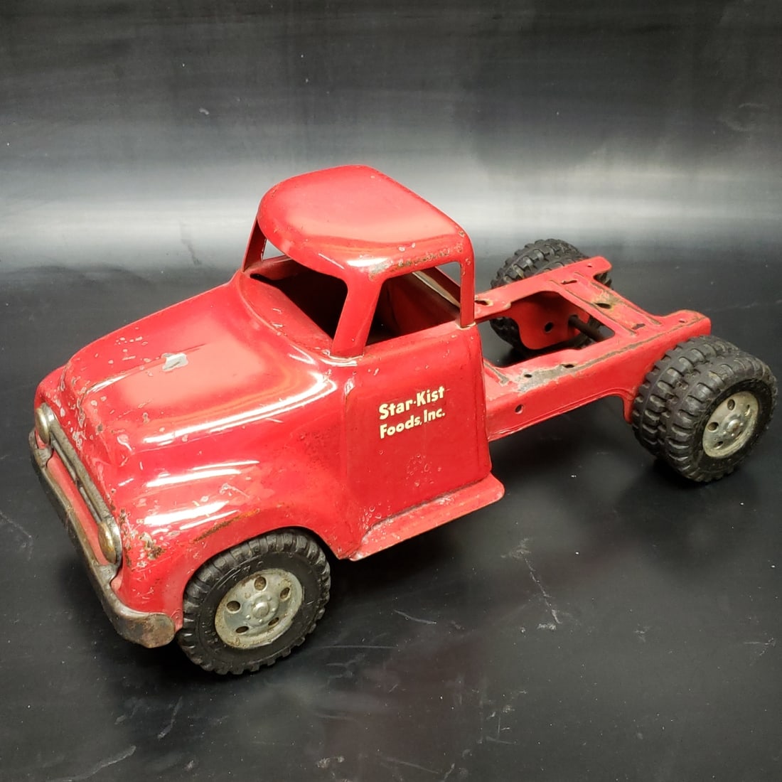 1954 Tonka Star-Kist Foods Tuna Box Truck Base: "Fresh to market from a lifetime collector. A nice selection of vintage tin and pressed steel along with die cast model and car related ephemera. All measurements are approximate.