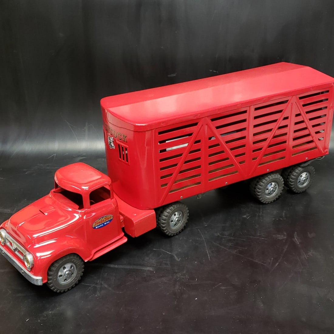 1954 Tonka Livestock Truck and Trailer Restored: "Fresh to market from a lifetime collector. A nice selection of vintage tin and pressed steel along with die cast model and car related ephemera. All measurements are approximate.