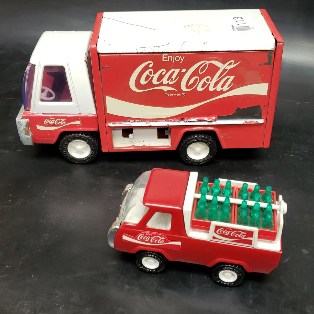2 x Vintage Buddy L Japan Coca Cola Trucks: "Fresh to market from a lifetime collector. A nice selection of vintage tin and pressed steel along with die cast model and car related ephemera. All measurements are approximate.