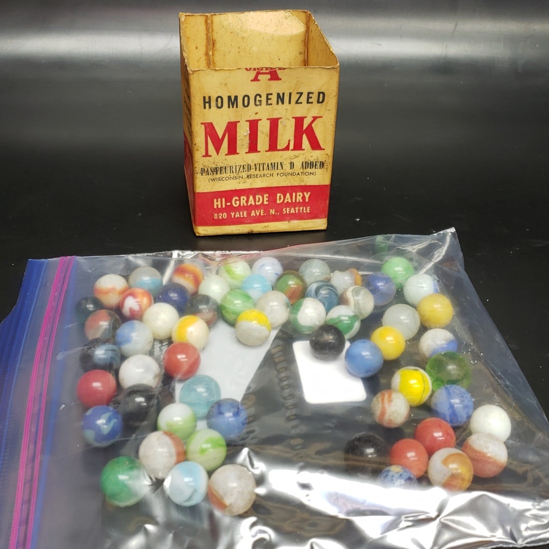 Selection of Vintage Marbles: "Fresh to market from a lifetime collector. A nice selection of vintage tin and pressed steel along with die cast model and car related ephemera. All measurements are approximate.