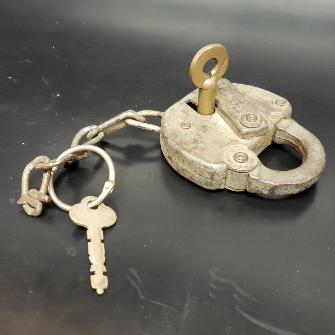 Adlake Vintage Padlock: "Fresh to market from a lifetime collector. A nice selection of vintage tin and pressed steel along with die cast model and car related ephemera. All measurements are approximate.