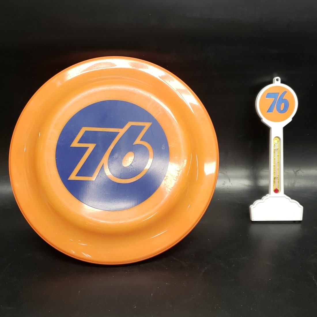 Union 76 Frisbee and Thermometer: "Fresh to market from a lifetime collector. A nice selection of vintage tin and pressed steel along with die cast model and car related ephemera. All measurements are approximate.