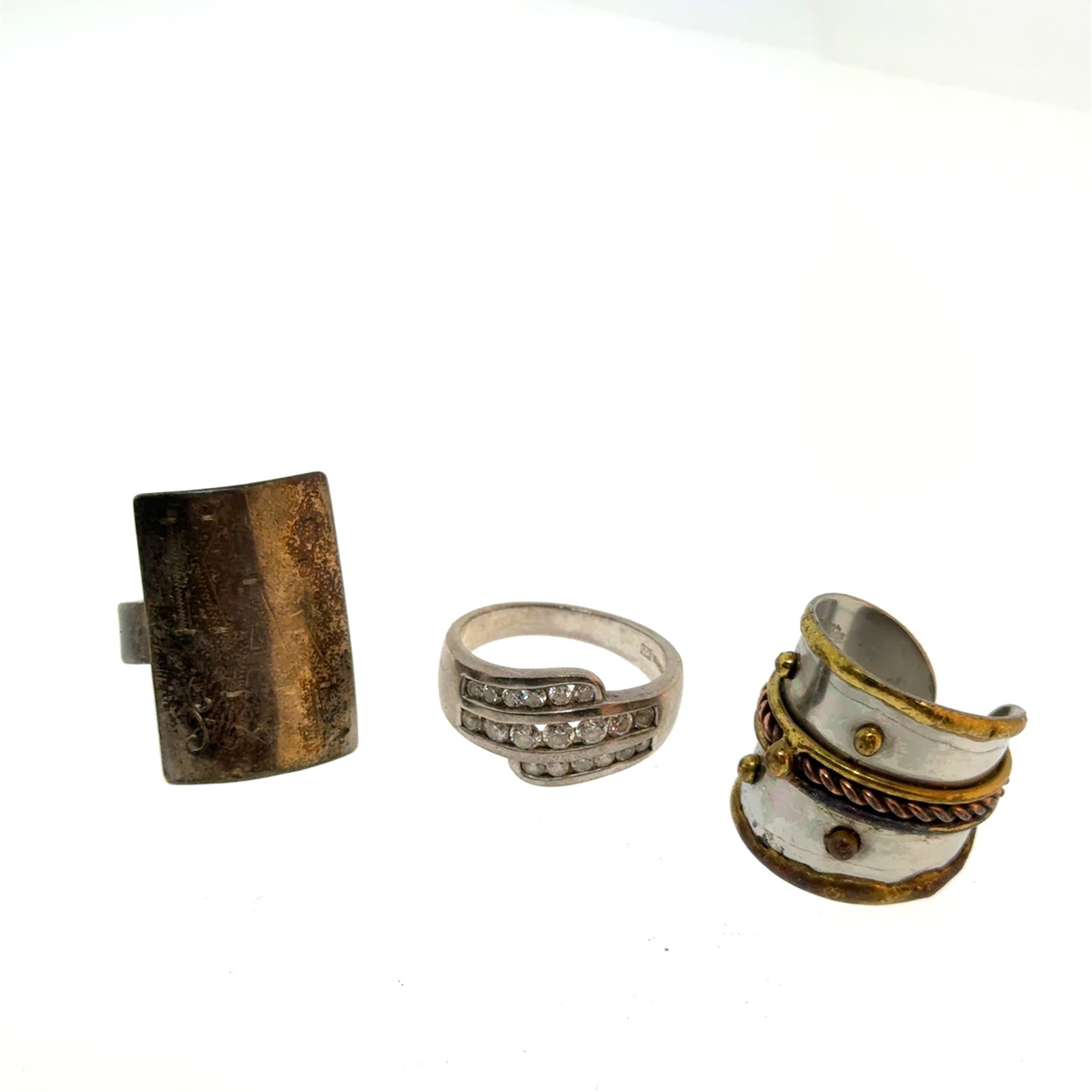 Selection of Silver Rings Shield KAM (5.5) CZ (8.5) Modernist (8) - 19.1g: A wonderful selection of estate jewelry including some antique heirloom pieces with family provenance. Item weights and dimensions are approximate. 4"x4"x4" 8oz shipping weight and dimensions.All weig