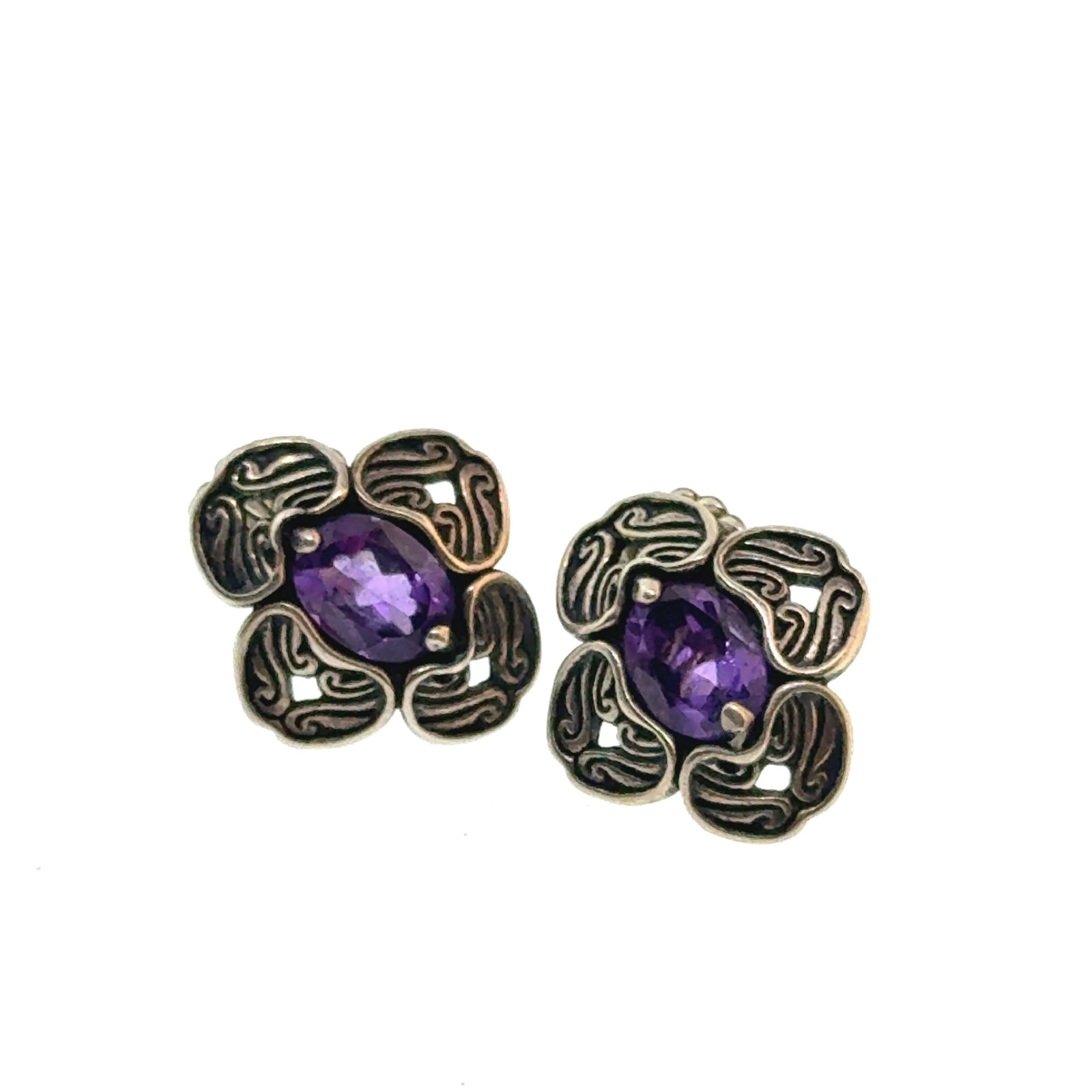 Pair of Sterling and Amethyst Native Earrings - 16mm - oz: "This is a continuation of our Pro Jeweler's Estate auctions. This auction includes his personal bolo tie collection as well as several of his own art jewelry pieces. There are other Southwest styled 