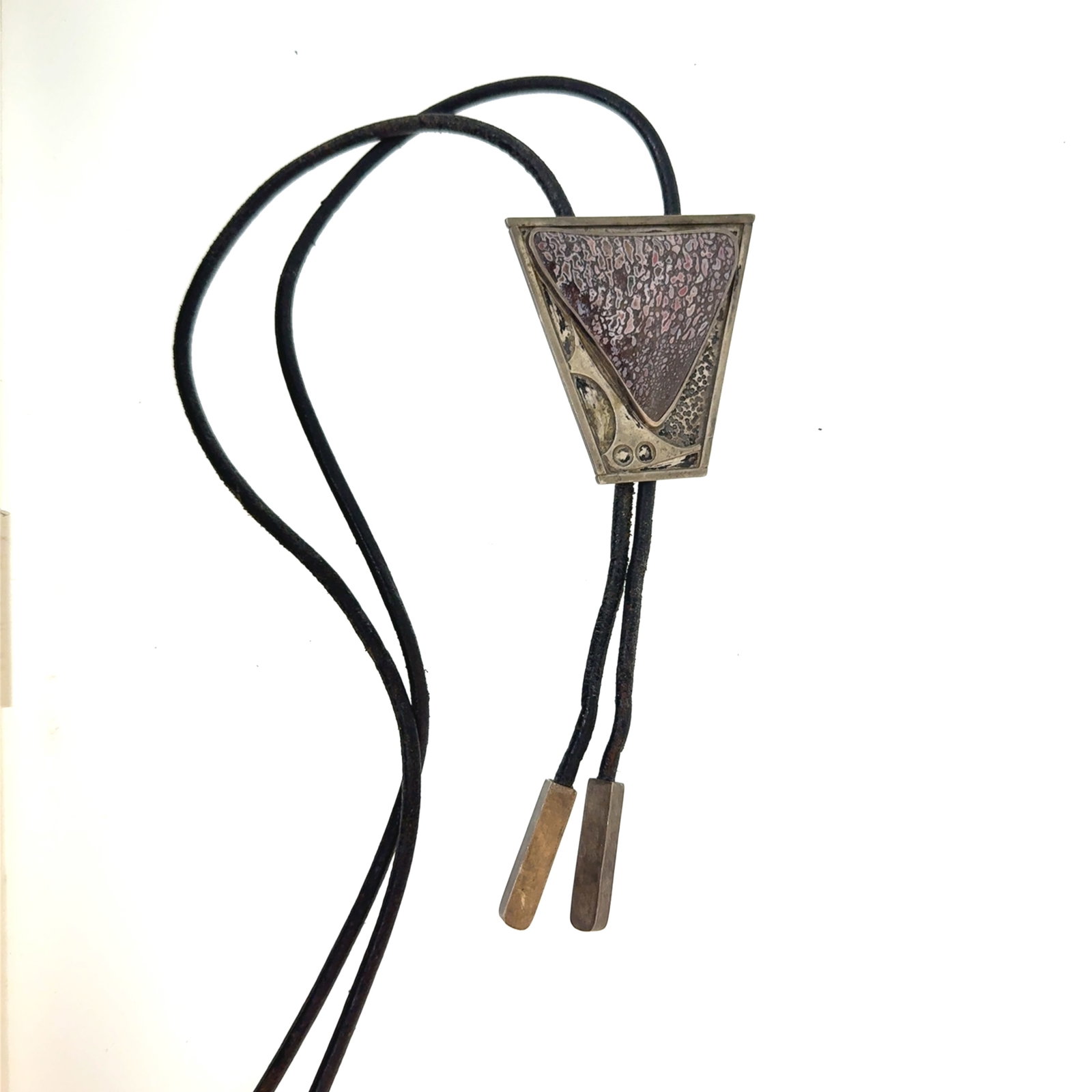 Purple Dinosaur Bone and Silver Abstract Bolo Tie Signed Erickson - 59x56mm - 2.4 oz: "This is a continuation of our Pro Jeweler's Estate auctions. This auction includes his personal bolo tie collection as well as several of his own art jewelry pieces. There are other Southwest styled 
