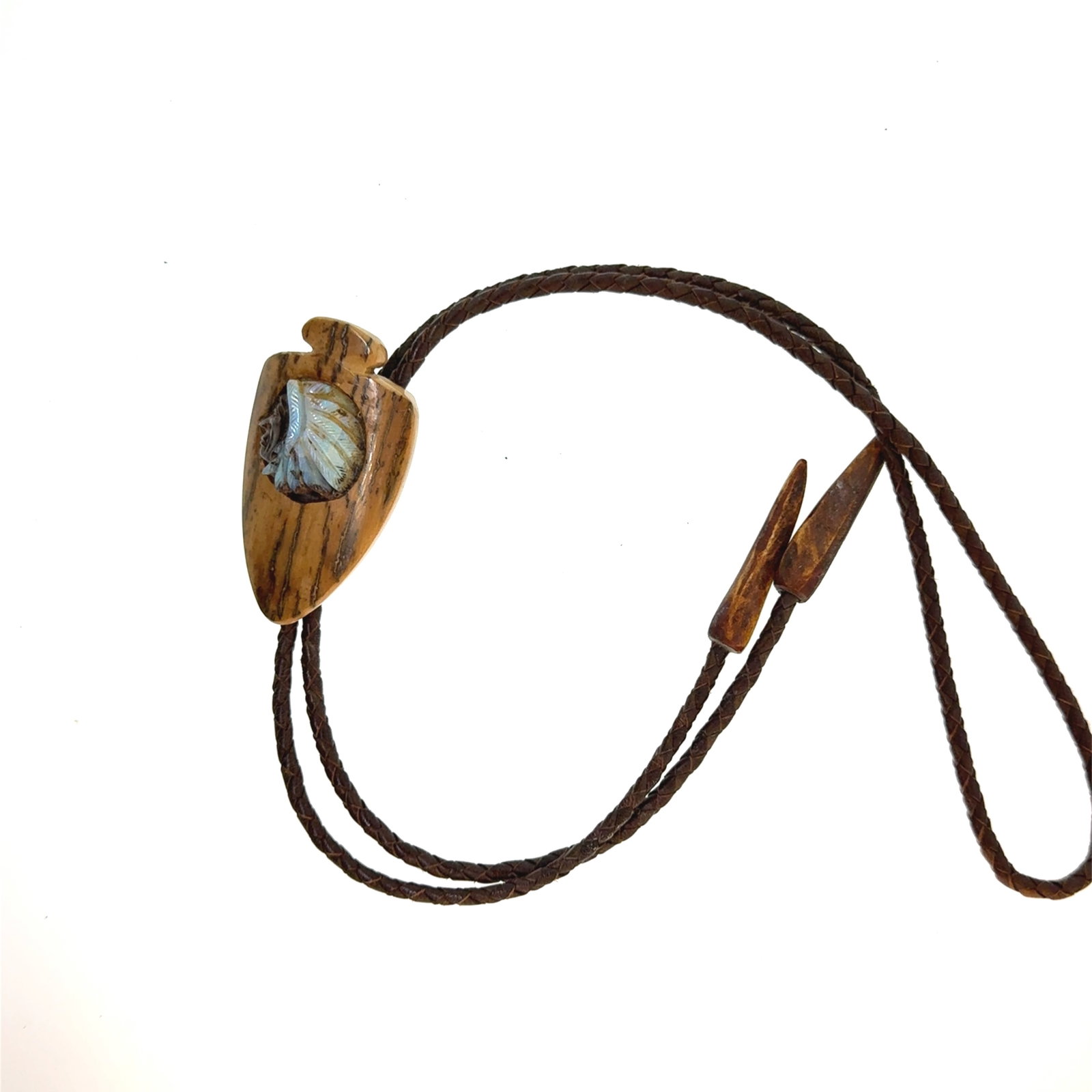 Carved Stone on Bone Bolo Tie - 40x65mm - oz: "This is a continuation of our Pro Jeweler's Estate auctions. This auction includes his personal bolo tie collection as well as several of his own art jewelry pieces. There are other Southwest styled 