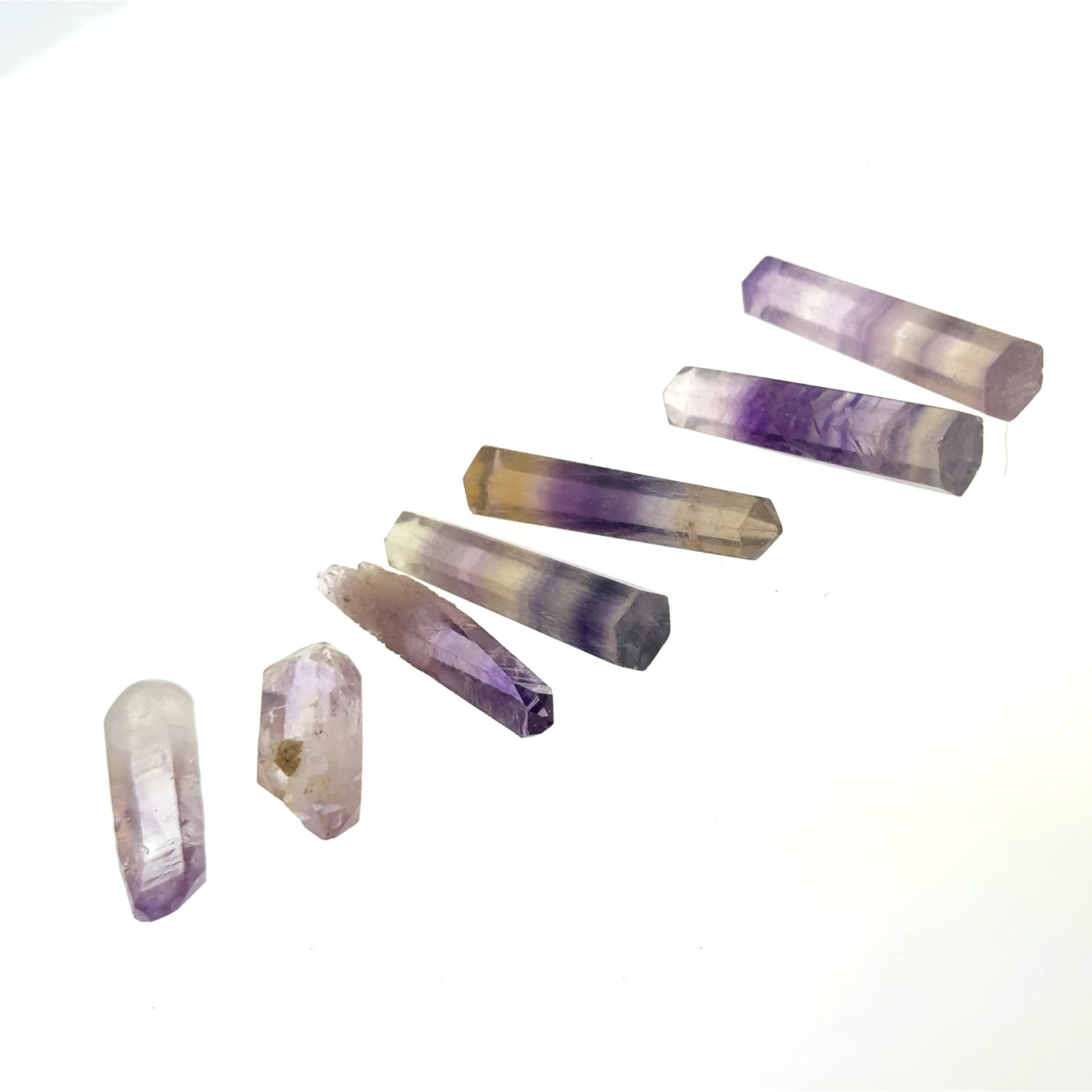 Amethyst and Ametrine Points 138.7c: This is a continuation of our pro jeweler's estate auction, but we've added some gems from another estate (JTV). The rest are from his personal collection, many faceted by himself. Gems were cataloged